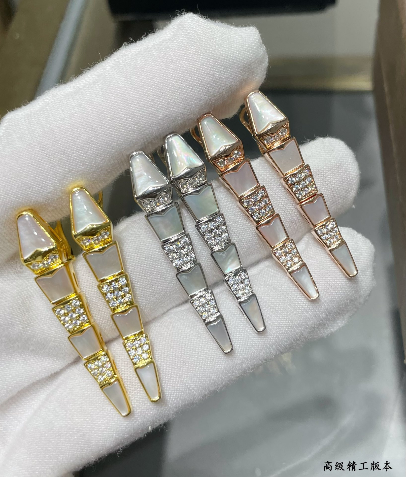 B*l*ai advanced mechanical shell snake earrings