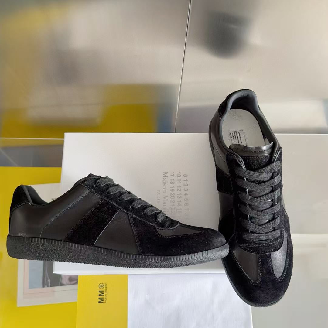 ua ma*s*n Ma*i*la mm6 sneakers