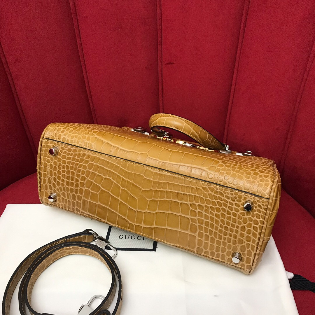 G*u*i zumi leather medium top handle bag