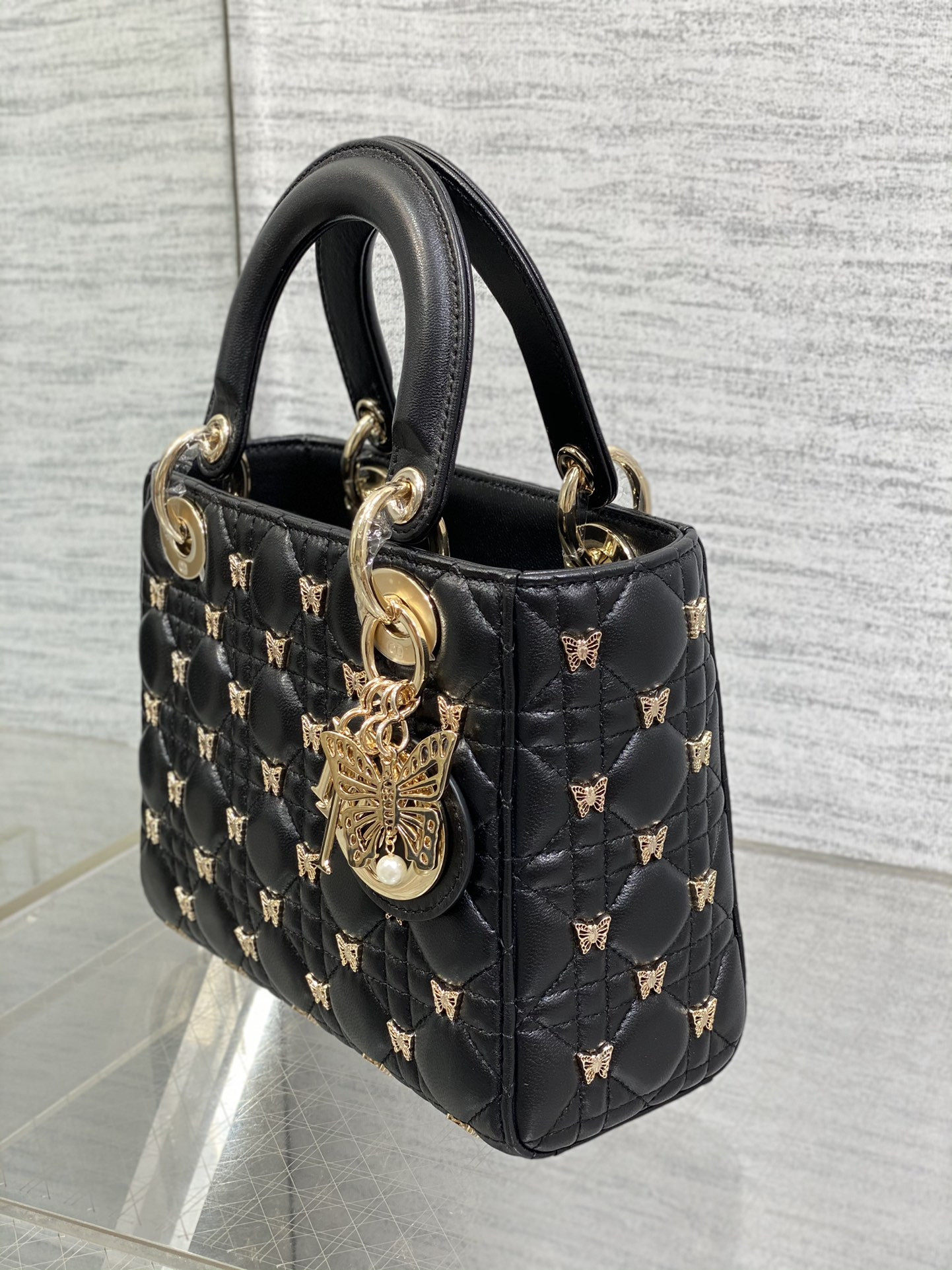small lady D*or black with butterfly studs