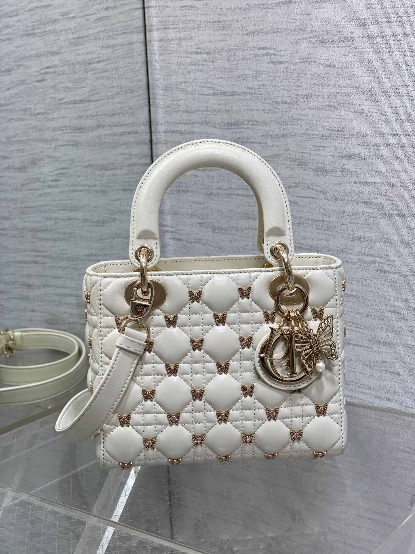 small lady D*or white with butterfly studs