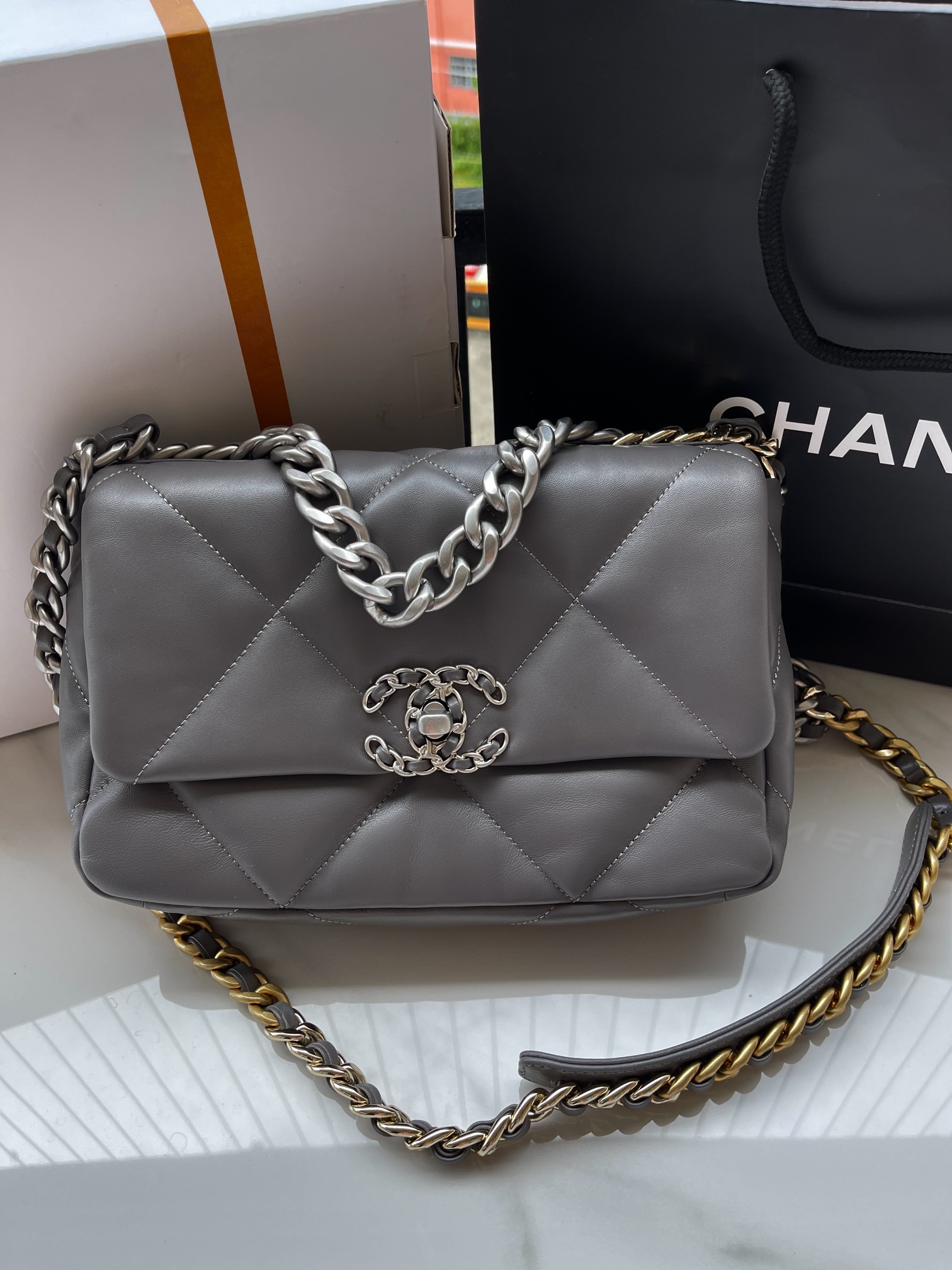 Ch*el 19 handbag shiny leather, gold-tone, silver-tone & ruthenium-finish metal dark gray 6.2 × 10.1 × 3.5 in