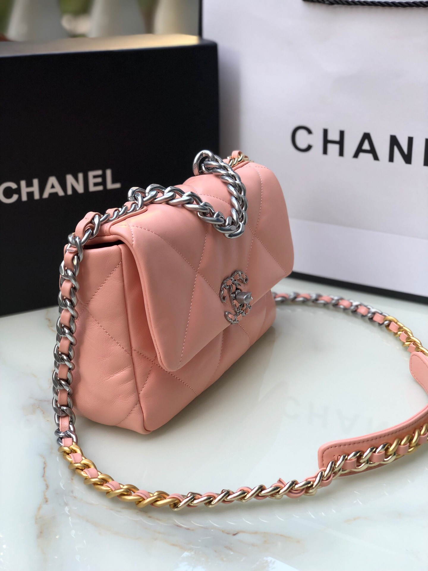 Ch*el 19 handbag shiny leather, gold-tone, silver-tone & ruthenium-finish metal light pink 6.2 × 10.1 × 3.5 in