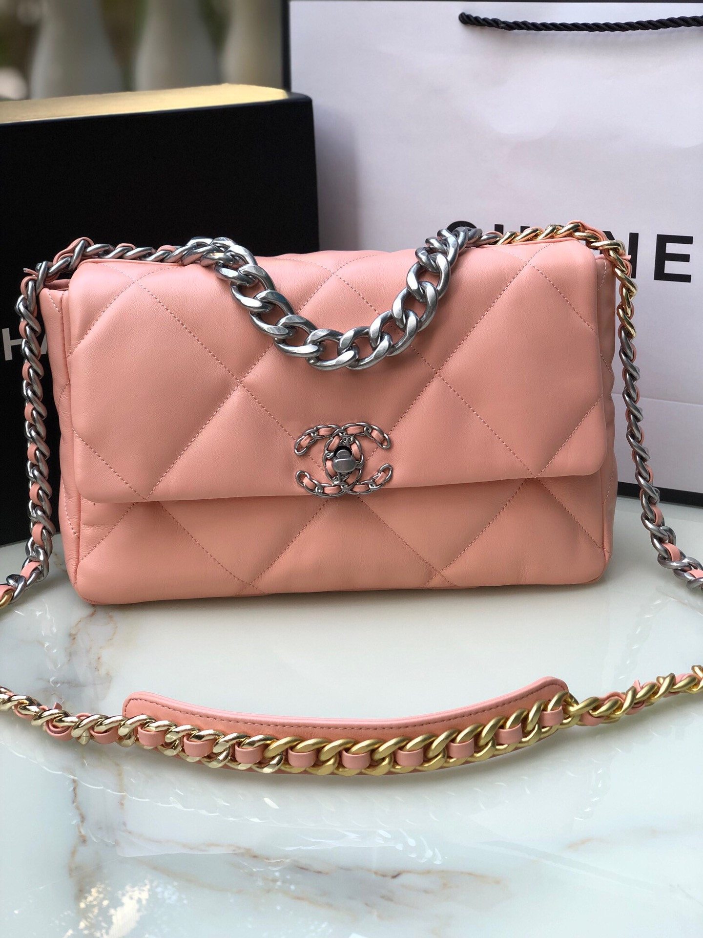 Ch*el 19 large handbag shiny leather, gold-tone, silver-tone & ruthenium-finish metal light pink 7.8 × 11.7 × 3.9 in