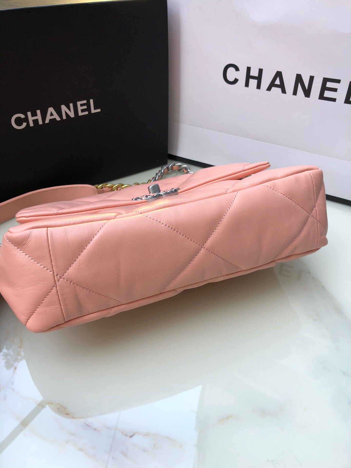 Ch*el 19 large handbag shiny leather, gold-tone, silver-tone & ruthenium-finish metal light pink 7.8 × 11.7 × 3.9 in