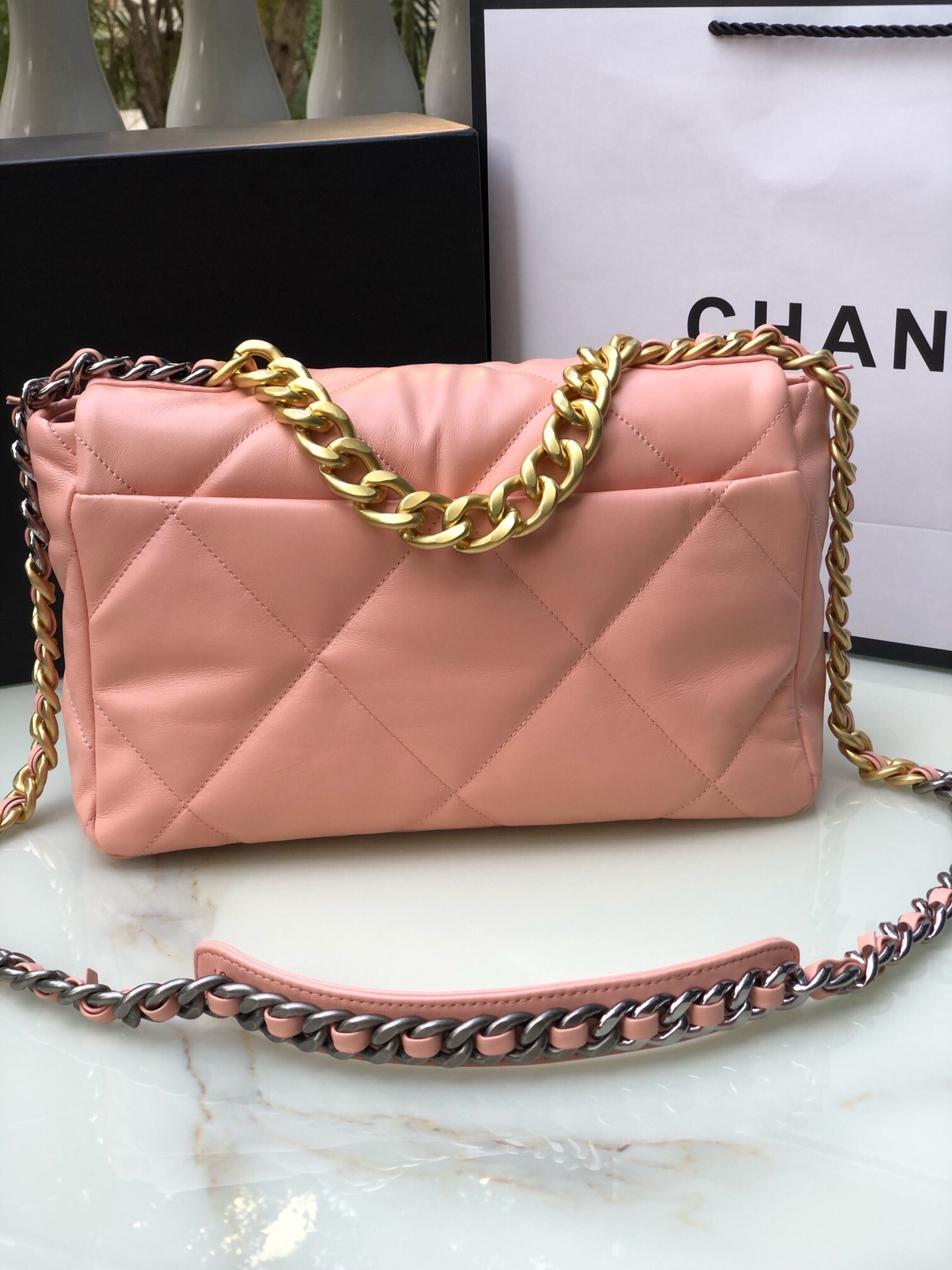 Ch*el 19 large handbag shiny leather, gold-tone, silver-tone & ruthenium-finish metal light pink 7.8 × 11.7 × 3.9 in