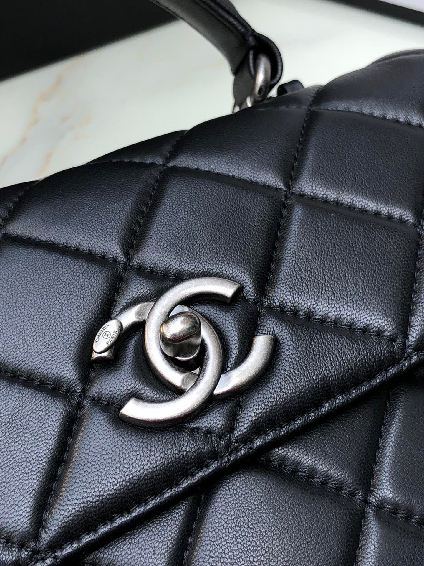 Ch*el flap bag with top handle 6.6 × 9.8 × 4.7 in