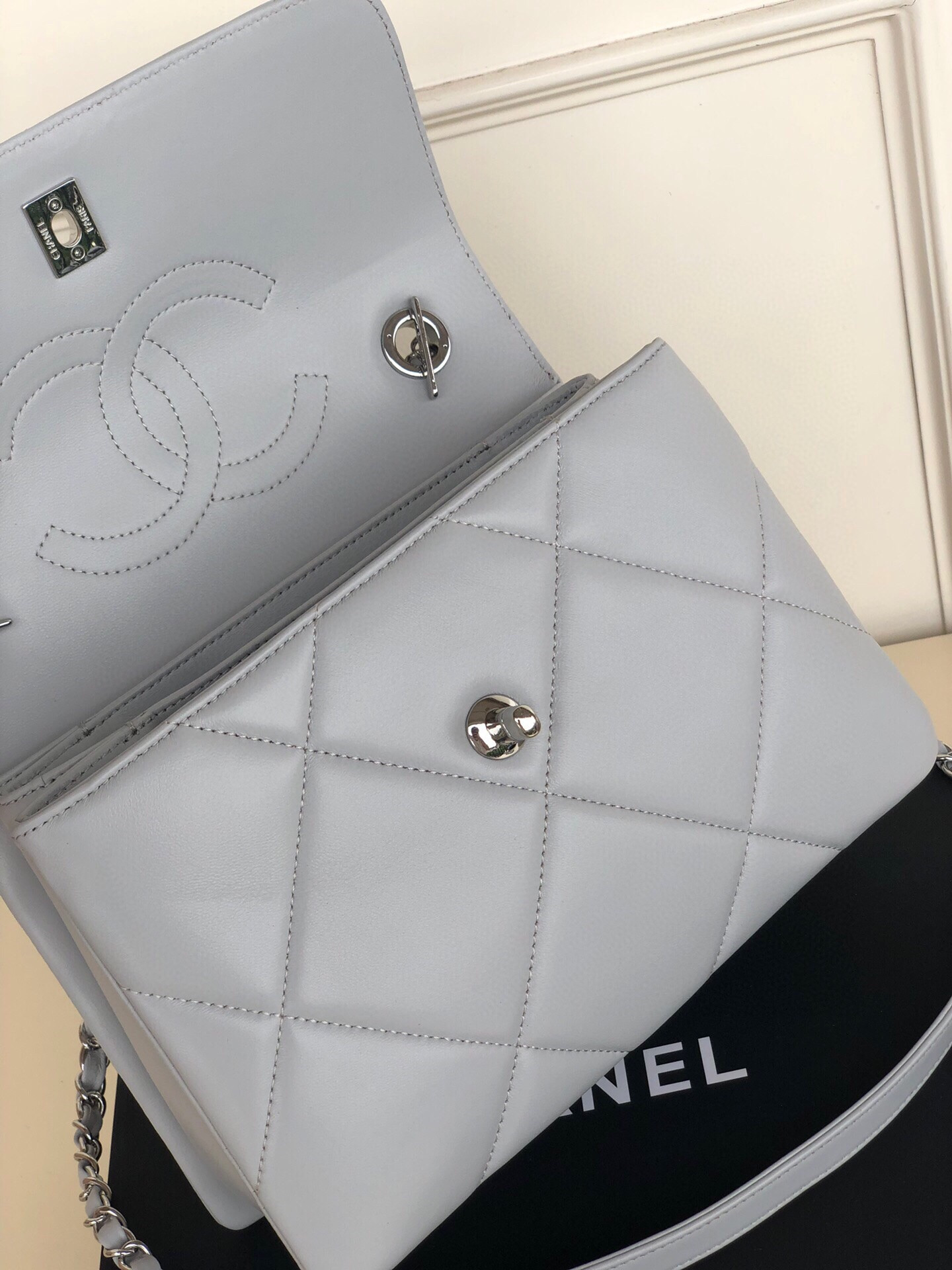 Ch*el flap bag with top handle 6.6 × 9.8 × 4.7 in