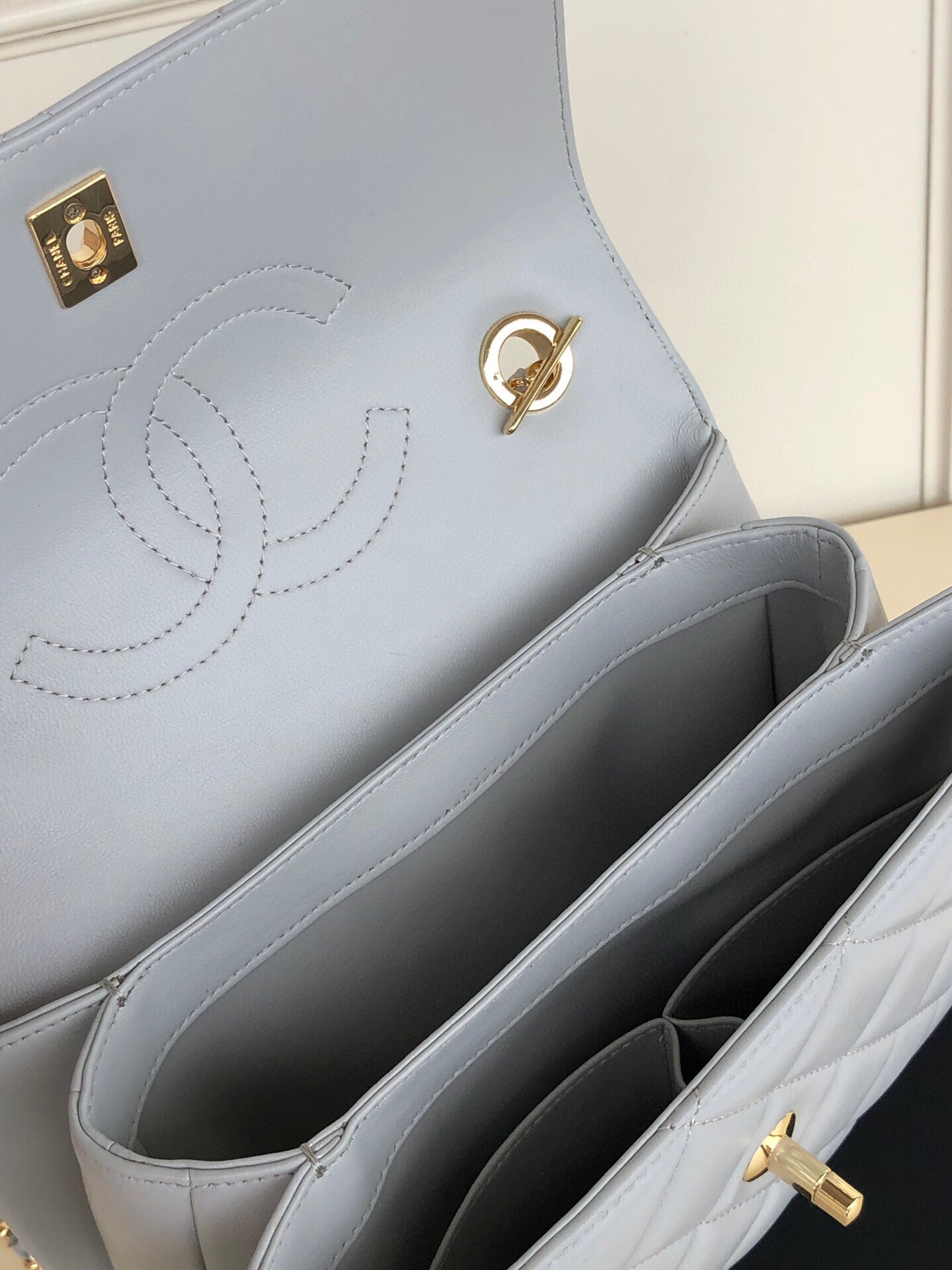 Ch*el flap bag with top handle 6.6 × 9.8 × 4.7 in