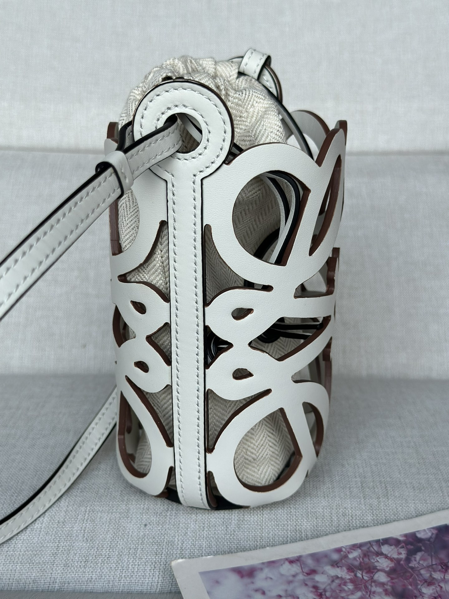 L0ew* anagram cut-out pocket in classic calfskin and canvas 20x11x8cm