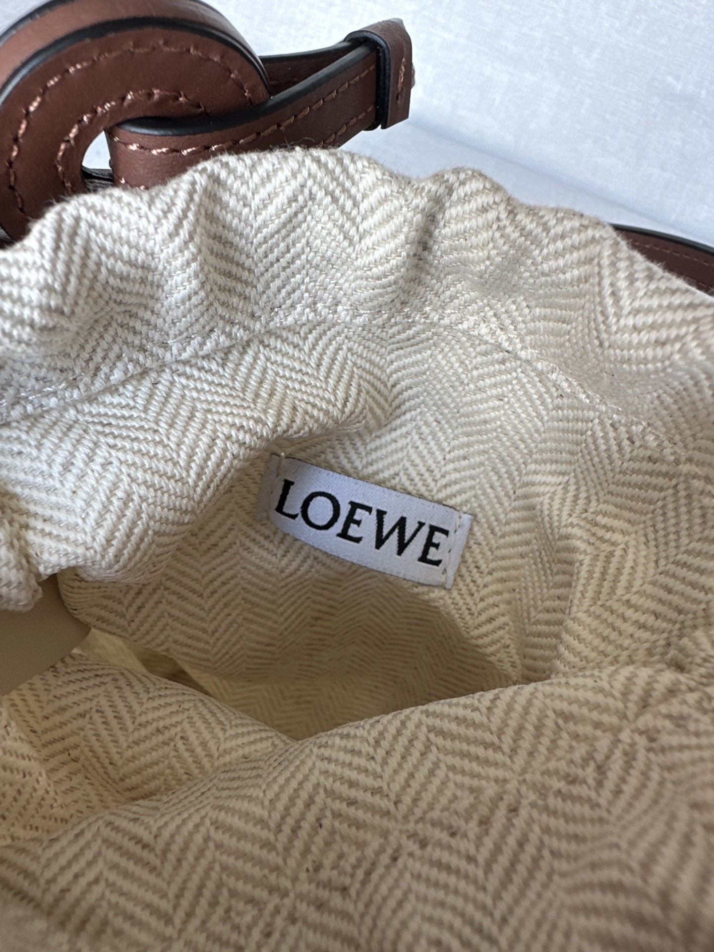L0ew* anagram cut-out pocket in classic calfskin and canvas 20x11x8cm