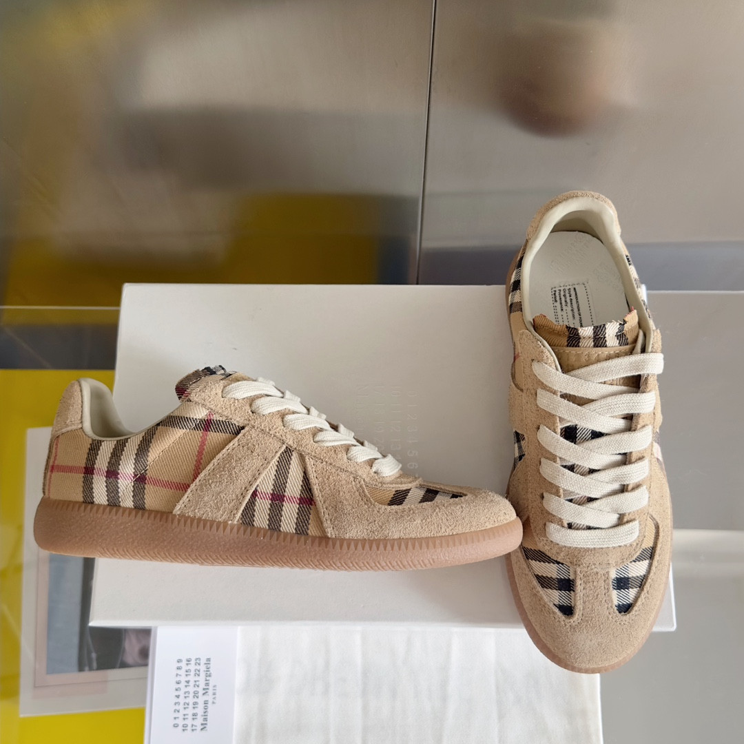 ua ma*s*n Ma*i*la mm6 sneakers